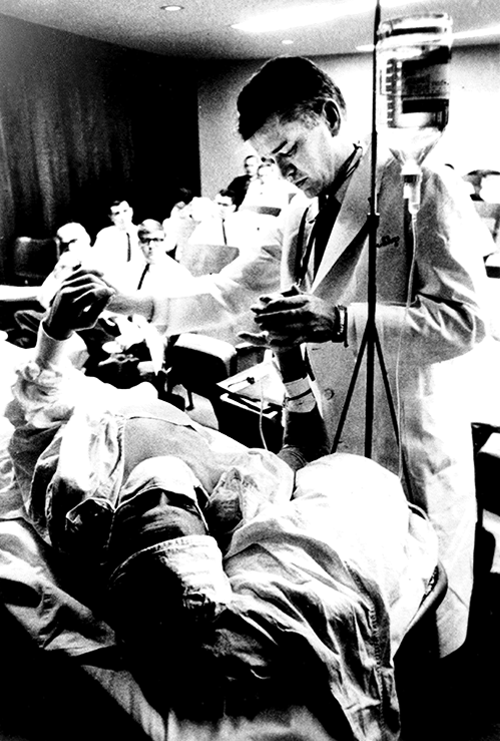 Dr. Shy examining a patient